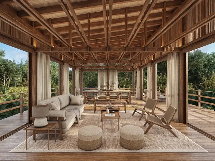 Casa Árbol social module: a timber-framed living and dining room open to the trees.
