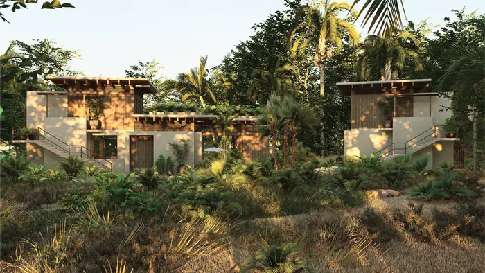Two Casa Lago houses stepping down a jungle slope at golden hour.