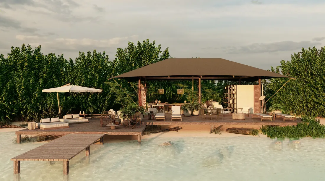 The Lagoon Club: a pavilion and deck on white sand with a jetty into clear water.