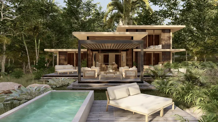 Casa Selva pool deck with loungers beside the house.